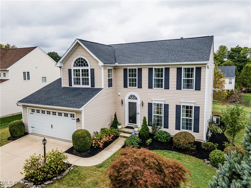 Welcome to 134 Creekledge, situated in the sought-after Revere School District in Copley Township. This beautifully updated colonial home offers easy access to shopping, parks, and hospitals. As you step inside, you'll be greeted by abundant natural light filling the 2-story foyer and the spacious dining room. The first floor features an open-concept layout with luxury vinyl flooring, fresh modern paint colors, crown molding, and chair rail detailing, creating an inviting atmosphere throughout. Thoughtful design choices can be seen in every corner. The eat-in kitchen, equipped with stainless steel appliances, showcases a composite granite farmhouse sink, granite countertops, and stylishly painted cabinetry. It seamlessly flows into the expansive Great room, which is surrounded by windows, and leads to a private office with French doors. The first floor is completed by a convenient laundry room and a half bath. Step outside to enjoy the stunning stone patio with built-in lighting, overlooking a spacious backyard perfect for summer activities. Upstairs, you'll find generously sized bedrooms, all featuring updated ceiling fans and ample closet space. The primary suite is a true retreat, offering vaulted ceilings, a cozy sitting area with a Palladium window, a large walk-in closet, and an en-suite bathroom with a double vanity, Moen fixtures, a shower door, a linen closet, and beautiful ceramic tile flooring. The second full bathroom has also been updated. The full, unfinished basement offers the potential to add a bathroom, with plumbing already in place. Additional upgrades include a carriage-style garage door, updated light fixtures, hardware, electronic keypad, and Moen fixtures throughout. The irrigation system ensures a lush, green lawn year-round. Roof replaced in 2017. This home won’t last long!