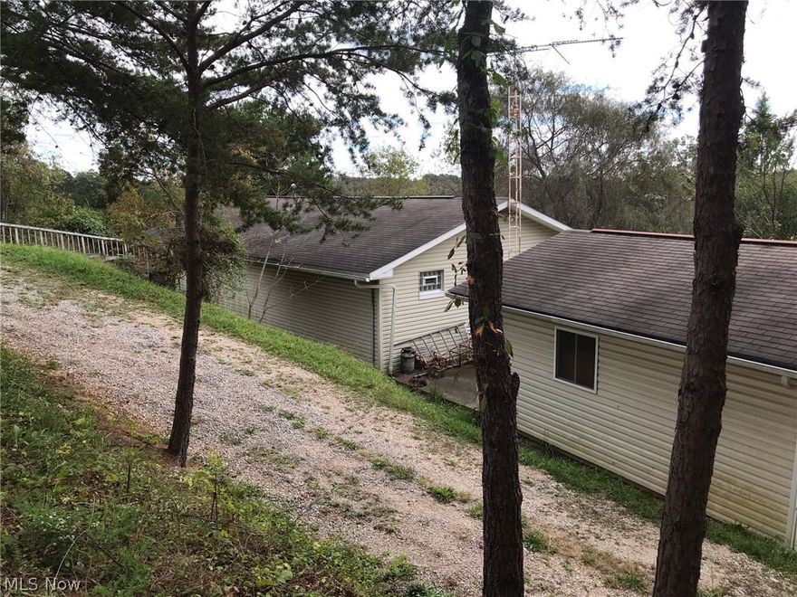 Country setting with nearly 3 and half acres, just minutes from town. Lots of potential, den area could be a 2nd bedroom.