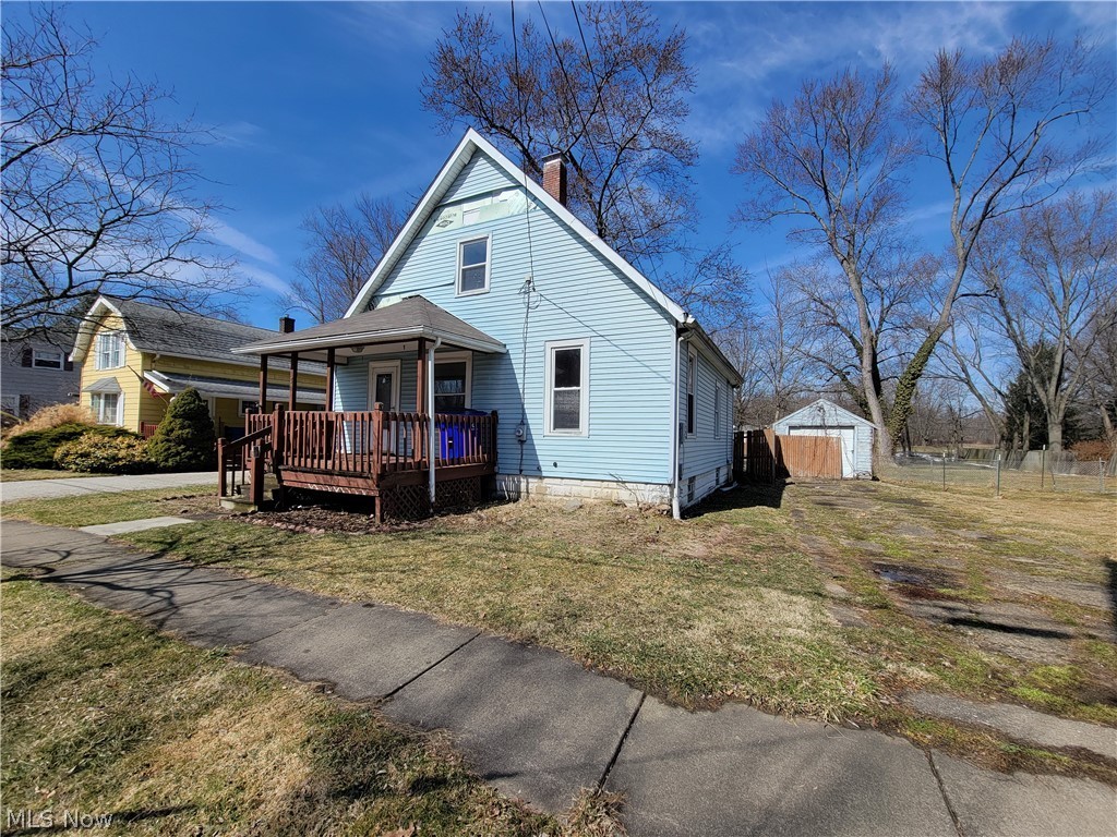 EXCELLENT investment! This is the kind of home you can update to either make your own, rent it or flip it! Loads of potential in this darling doll house! There is a large living room that has a built-in wooden unit for a gas heater (no insert), large bright windows and lots of original woodwork. The spacious eat-in kitchen has a very neat built in pantry that already has that "farmhouse" style! Two-tier deck just off the kitchen and a covered front deck! First floor bedroom with an extra large walk-in closet or make it a first floor laundry room! Two bedrooms upstairs and a full basement. HUGE fenced in rear yard and a detached garage! Ideal location as this home is less than 2 miles from University hospital, 6 miles to Kent State University, 7.8 miles from the Ohio turnpike and within 30 minutes to Cleveland and Akron! This home is in need of some TLC but will be well worth your sweat equity! Sold AS-IS. Cash or conventional only. Seller is the administrator to the estate and says bri