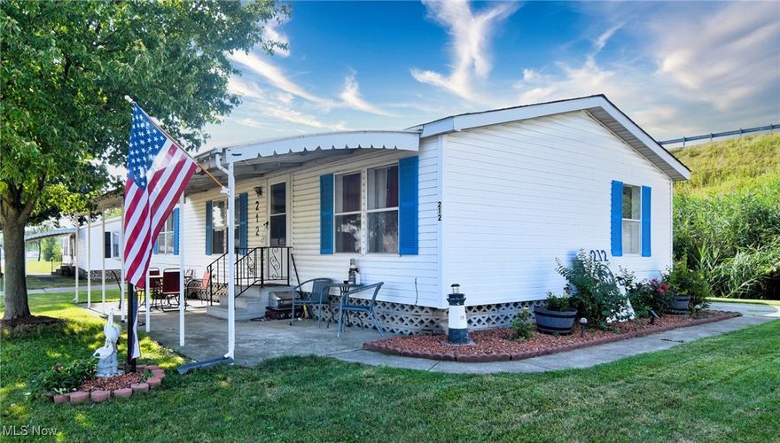 Financing recommendations available ! Beautifully Updated 3-Bedroom, 2-Bath Manufactured Home
Approximately 1,100 sq. ft. with an open and inviting layout, this home is nestled in a wonderful community offering an array of amenities — including a sparkling pool, clubhouse/community center, several picnic pavilions, a scenic lake, dog park, new playground, and basketball courts. Remodeled last year, the home features elegant new porcelain flooring throughout, updated décor, and all-new appliances (included with sale). Most furniture and contents are negotiable. The roof is approximately 7 years old, and brand-new heat tape was installed last fall. Move-in ready and perfectly located --ALL ITEMS CAN STAY - Lawnmower, snowblower, chest freezer, extra "garage", refrigerator king size bed with hybrid mattress (about one year-old), sectional that is about one year old, dining room, table, full-size golden tee video game, electric grill, ventless propane heater for the outdoor area. 51 inch Samsung TV, Coffee Bar, Outdoor bar with mini fridge. Leather armchair, twin size sleigh bed, outdoor kitchen counter with stainless steel counter.
Outdoor patio pub table with two chairs. Outdoor patio table with four chairs.--