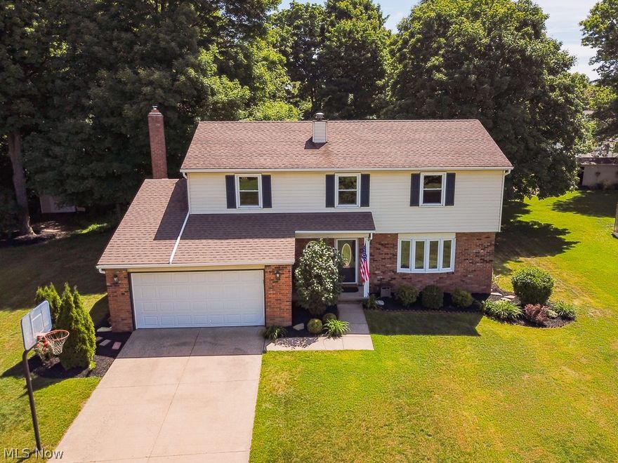 Fully Renovated Colonial in Mentor!  Kitchen fully renovated with new upscale cabinetry, new appliances, ceramic tile flooring, and granite countertops!  New flooring throughout. Fireplace was fully renovated with a new wood burning insert, new mantel and tile. Bathrooms have been renovated, basement finished in 2018 with expanded living space, carpet, drywall and glass block windows.  Don't miss the outdoor oasis!  Beautiful patio was put in 2017, outdoor lighting, new landscaping, and fire pit area are all amazing places to entertain and relax.  All major replacement were recently made as well. Furnace (2016), Hot water tank (2016),  AC (2018). Move right into this updated, well-maintain and worry-free home!