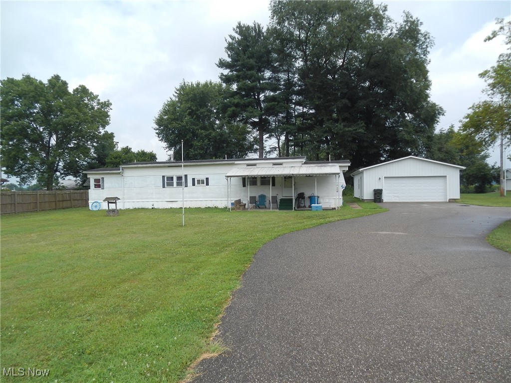 Turnkey Investment Opportunity – Tenant in Place, Great Location!
Add this solid investment to your portfolio! This 3-bedroom, 2-bath 1976 Holly Park mobile home sits on a generous 0.57-acre lot just outside West Lafayette. The property includes a sunroom addition, upgraded house-style roof, replacement windows, and brand-new steel skirting (ordered and to be installed). Features newer central air and gas furnace, plus all appliances convey. A spacious 24x30 detached garage and newer blacktop driveway (approx. 2 years old) add excellent value. Currently tenant-occupied, providing immediate rental income. Located in a quiet, desirable area just minutes from town—this is a great long-term investment!