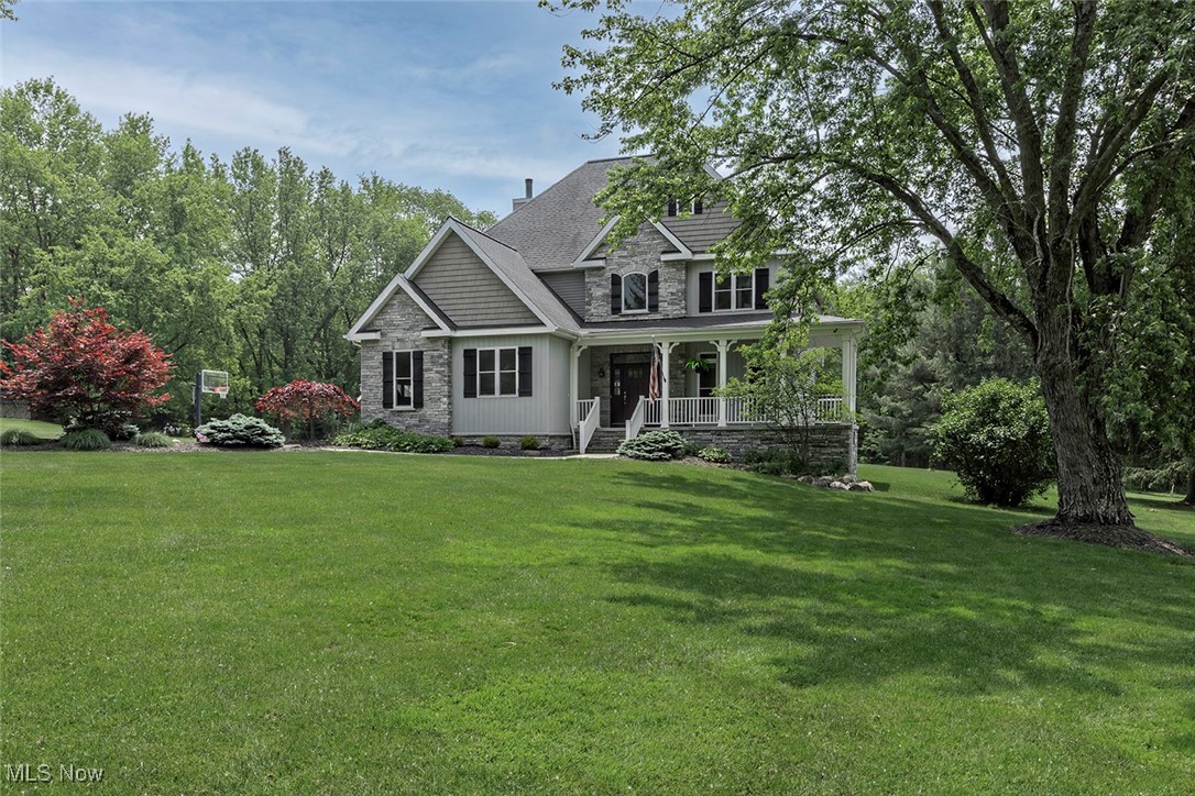 A pristine, newly built home in Novelty with great yard space and privacy on a quiet street. A striking exterior with a blend of stone, shake and vertical siding, all complimenting the wrap around front porch. Upon entry, a two-story foyer connects through to a bright living room with wood burning fireplace, passing by a mudroom & half bath, or over to the private office. Open living, kitchen & dining are ideal for entertaining, especially with access to the back patio. This dream kitchen is comprised of custom cabinetry with undermount lighting, stainless-steel appliances, herringbone marble backsplash, pantry, office zone and island w/ farmhouse sink. Wood style tile flooring throughout the first floor is durable and resilient. Upstairs holds the luxe primary suite with hardwood floors, as seen throughout the entire upper level, including an amazing walk-in closet and renovated spa-like bath including dual vanity sink, claw foot soaking tub, marble tile and shower. Three more spacious bedrooms with walk-in, customized closets and a full bathroom with dual sinks and a shower bath combo are off the upstairs hall. Also conveniently located upstairs, is the laundry room with additional cabinetry, counter space and utility sink. The finished basement includes entertainment, fitness, game/ play area, a full bath and is plumbed for a kitchenette. It's accessible from the garage and has wood style tile flooring throughout. There are three storage rooms in the basement, two of which were built with the intentions for wine and food cellars. For more storage, there’s an attic space and garden shed as well. Enjoy the outdoors, shaded on the covered front porch or enclosed back porch with ceiling fans, or if you like sunshine, utilize the fenced garden area with raised, planter beds or head out to the play equipment. In the renowned West Geauga school district, near restaurants, wineries, retail, golf and parks; off route 306 w/ easy access to highways 271 and 90.