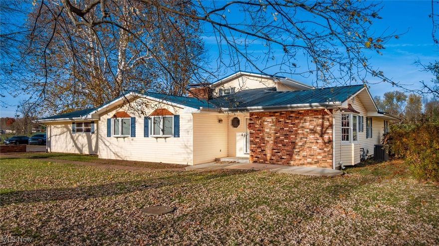 Motivated Seller!! Welcome to this 5 bedroom, 2.5 bathroom home overlooking the Muskingum River! This residence combines space, comfort, and beautiful views. With sprawling space, this home features a spacious kitchen with butcher block countertops, spacious living area with fireplace, home office/den, first floor primary bedroom, two more bedrooms, two full bathrooms with one being a jack-and-jill, one half bathroom, and first floor laundry room. The second story has two more bedrooms. This home has lots of closet/storage space and updates throughout the home include new flooring, paint, carpet, and trim! The basement has a bar area and fireplace with more storage space. It has a two car garage with an additional one car detached garage/outbuilding. The AC and furnace have been updated within the last six years and the metal roof was replaced around 10 years ago.