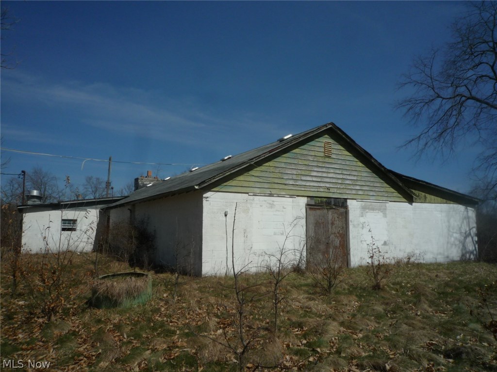 55 acres of vacant land, formerly used as a sportsman club. Partially treed with a 2600 sq foot concrete block building. Property can be accessed by easement form two different roads. electric is available, and there is an old well and old septic system.
