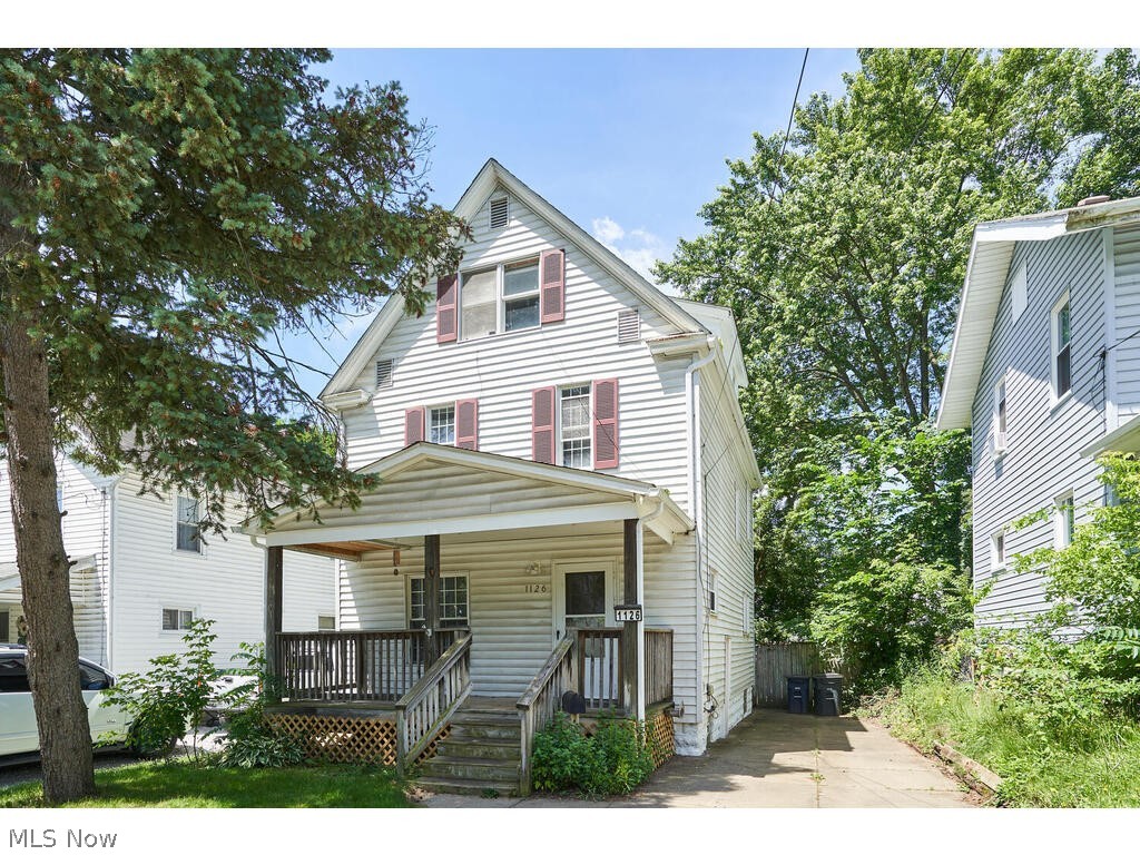 Welcome to this new listing in North Hill. This 5 bedroom Colonial is conveniently situated near the Cuyahoga Valley National Park, major highways, and shopping centers. Additionally, you'll be just a short drive away from downtown Akron and Cuyahoga Falls. Allow yourself to relax and unwind after a long day on your covered front porch. As you step inside, you'll be greeted by an expansive family room and an exceptionally spacious dining room, both of which are ideal for hosting guests. The kitchen has been thoughtfully updated with oak cabinets, brushed nickel hardware, black/stainless steel appliances, a lovely pantry, and a butler's pantry that leads to the fenced-in backyard. Moving upstairs, you'll discover 5 bedrooms. Three of them are located on the second floor, along with a full bath, while the remaining two are on the third floor. Additionally, the partially finished basement offers ample space for your creative endeavors and can serve as an additional living suite. Don't hesitate to call today and schedule your private showing. Rest assured, you won't regret it.