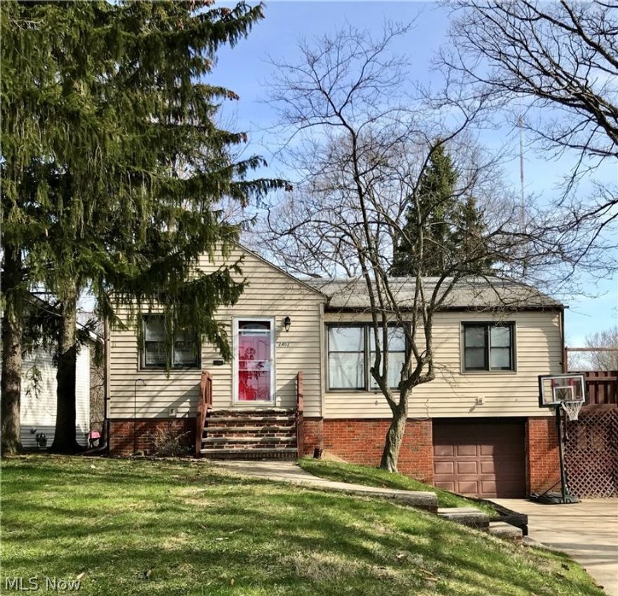 Updated raised ranch on desirable lot, right next to Center Park! Kitchen with oak cabinets, backsplash and ceramic flooring. Furnace and central air-2009. Newer carpet and paint. Dining room. Updated bath with ceramic tile and backsplash. Ceiling fans in all bedrooms. Finished Rec room in basement. Deck and fenced in yard. Beautiful wooded lot with stunning views of the Metroparks. One car attached garage. 1 year HMS home warranty. Don't miss out!