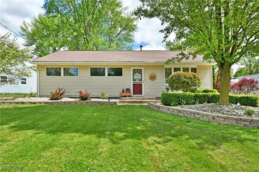 Perfectly cozy, charm packed and full of wonderful surprises from the inside out, this darling Champion ranch is dressed to impress! Offering up a desirable three-bedroom layout, this wonderful home is hidden away amongst a quiet neighborhood along a short, dead-end road. Hiding behind the shade of a tall tree, this beauty reveals its manicured landscaping and cement driveway that leads up to a must-see, renovated and heated garage. Adding to the curb appeal, a fenced-in yard includes a pea stone play area, perfect for pets, children or low maintenance outdoor relaxation. A finished sunroom connects the garage for four-season personal getaways. Through the decorative front door, an inviting living room presents its gracious layout as hardwood styled flooring runs below. Around the corner, casual dining space greets the beautifully updated kitchen to include a gorgeous, tiled backsplash. Stone-look countertops add a touch of class as a sliding barn door hides a large pantry while laundry services complete the package. Recessed lighting adds to the appeal. Down the main hall, a brightly lit full bath provides a raised basin sink and sleek tile work. The trio of colorful bedrooms draw you near with their endearing looks and personal closet space.