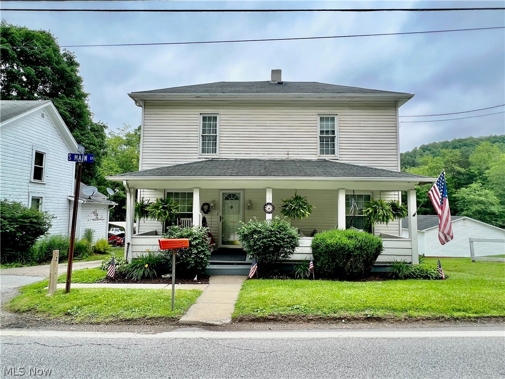 Make sure you check out this well maintained home with updated windows throughout, a beautiful front porch, large living room, eat-in kitchen, a 1st floor bedroom, laundry room and full bathroom. Two spacious bedrooms are on the second level. The walk-out basement has a second set of washer/dryer hookups, new 200 amp electric service and breaker panel. A spacious yard leads to. the 20 x22 garage.