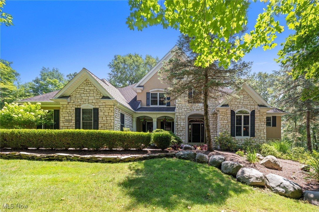 Beautiful Custom Built Home by Payne & Payne nestled on 3.5+Private Wooded Acres! This Spacious home boasts over 5000 finished sqft with 4 Bedrooms, 4.5 Baths & open concept living. Inviting Foyer welcomes you into the Dining Room with butlers pantry & vaulted Home Office with transom french doors. Sun-filled 2-story Great Room with wall of windows & stone fireplace. Gourmet Kitchen with maple cabinetry, granite counters, center island breakfast bar, travertine tile backsplash, stainless steel appliances include double oven, gas cooktop & ceramic flooring through to Dining area with access to the screened-in cedar tongue & groove sun porch & Trex deck. Retreat to the 1st floor vaulted Primary Suite with hardwood floors, large walk-in closet & Glamour Bath with separate vanities & soaking tub. Second floor includes Loft area overlooking the Great Room, 2nd Master Bedroom with private bath & walk-in closet plus 2 additional bedrooms & full bath. 1st floor Laundry Room & half bath. Full finished lower level includes Family/Media Room with new carpeting, stone fireplace, Full Bath with steam shower & 6-person sauna and walk-out to brick paver patio with waterfall & pond. Relax and entertain in the expansive outdoor living space complete with heated 35 ft in-ground pool installed in 2022 with concrete decking, surrounded by wrought iron fence and complete with covered outdoor kitchen & bar, built-in firepit. Situated on quiet cul-de-sac street in prestigious Walden Oaks community, this home is surrounded by mature trees with professionally landscaped yard and manicured beds full of lush plantings. Paved drive with turn-around, 3+car attached garage plus storage shed. Ideal home for the growing family or multi-generational living. Thoughtfully designed and cared for with many upgrades throughout....must see to appreciate all this home has to offer! Close to schools, Geauga Parks & hospital, YMCA and just minutes to freeways and all amenities!