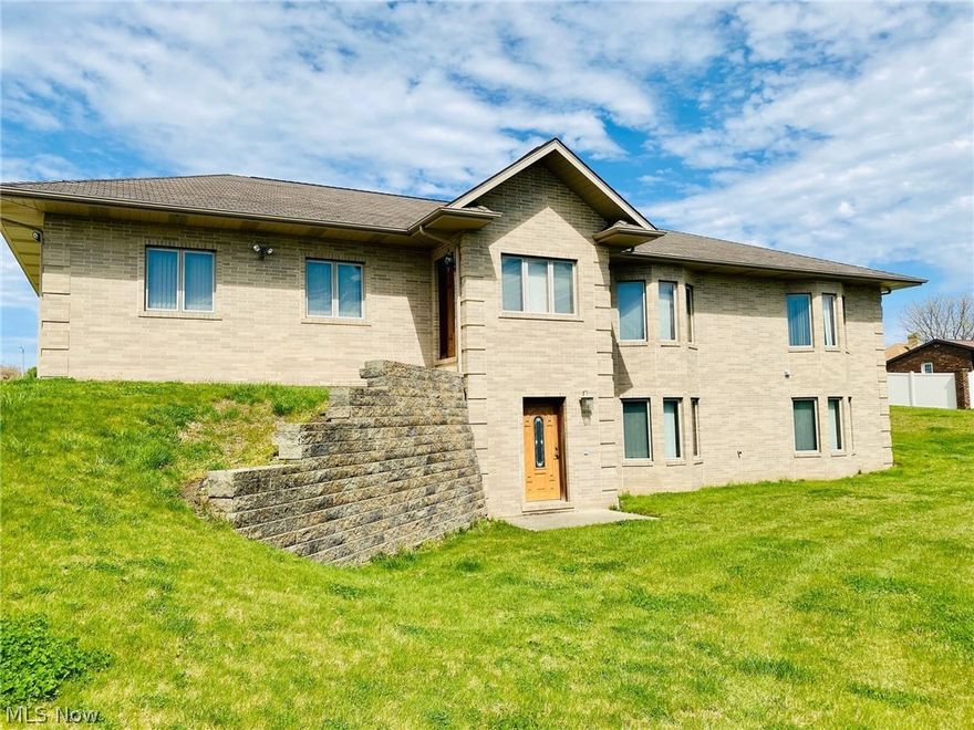 Weirton- Location at its finest! This 3 bedroom all brick home located at Angelina Estates on approximately 3/4 of an acre. This home has great bones, topnotch construction, 4296 sq. ft. of living space and large back yard waiting for a buyer to use their imagination in designing additional amenities. Large eat in kitchen, formal living and dining room, large master bedroom with large master bath. 1st floor office located off of living room. Lower level is equipped with spacious family room with wet bar and 2 bedrooms and large bathroom. This home is easily designed to accommodate and in law suite on lower level. If ample amount of living space is needed for your growing family this outstanding property will meet your needs. Lets call this one home and make it first on your dream home list.