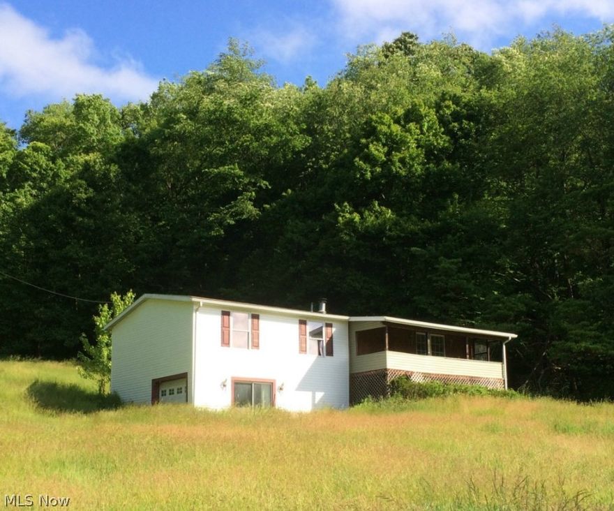 Enjoy the peace of country living with the convenience of easy access to the highway. This manufactured home sits on 1.53 acres at the end of a dead end street. It features 3 bedrooms, 1 bath and a walk out basement. Very close to Midvale Elementary. Nice floor plan and the living room has a fireplace. This property sells as is and there are no disclosures. With your own finishing touches this property has endless potential.