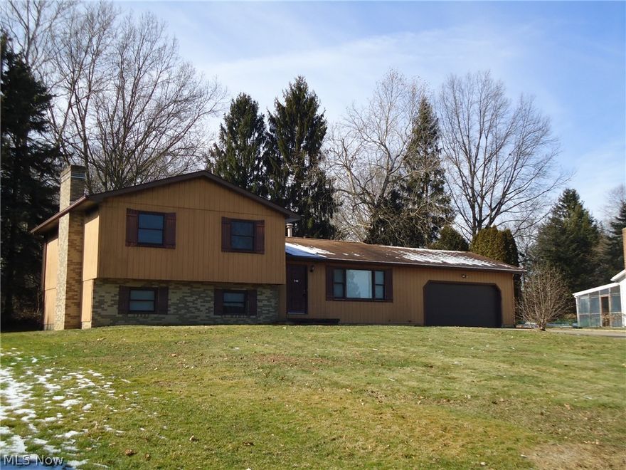 Great Tallmadge neighborhood.  Spacious 4 bedroom/ 3 full bath split level home.  Family room with built-in bookshelves and Fireplace.  Applianced Kitchen.
Dining area with sliders leading to concrete patio.  Large lot with storage shed/workshop.  2 car attached garage.  Convenient location. 
Call today for your private viewing.