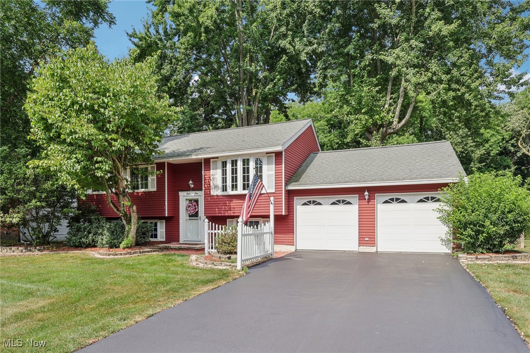 Welcome to 321 Manhattan Parkway Painesville Twp! Nestled in a Much Sought After Neighborhood, Park Estates Subdivision, Painesville Twp with your own Private backyard Oasis with an In-Ground Heated Pool! The welcoming foyer leads up to the upper level, featuring a formal living room or dining room with bay window that provides plenty of natural lighting. The spacious eat-in kitchen has two large pantries! Well maintained wood flooring and Pella sliding door allows access to the decks, pool and beautifully landscaped backyard. The upper level provides a primary bedroom with Two closets, custom blinds and carpet flooring. The second bedroom has a walk-in closet, area possibly for a desk or sitting area. The upper level full bathroom has a shower tub combo. The lower level features a family rec. room with a stunning fireplace, windows with custom blinds and carpeting. Great for entertaining or relaxing. Full bathroom with walk-in shower. Laundry room with a utility tub and wall attached compact ironing board. Third carpeted Bedroom, window with custom blinds, and possible sitting/office area with vinyl flooring. Entrance to a Deep, Two-Car, Attached Garage with storage. Attic access with lighting and flooring for extra storage. Additional highlights include an In-Ground Heated Pool for entertaining and relaxing! Beautiful 2 Level Deck that leads to a Private Fence-in backyard. The lighted landscaping, rose garden, paver blocks, and decorative stone borders and fencing are just some of the highlights of this oasis! Nature Stone borders the 16 x 32 In-Ground, reinforced concrete Pool with liner. Pool features are walk-in steps, ladder and diving board. The pool is heated with propane. All equipment for pool maintenance remains at home. Including the Solar cover, floating chairs, and closing cover for pool and stairs. Extra Storage under the deck! Don’t miss an opportunity to own a home tucked away, near the end of a Cul-de-sac! Call me today for your private showing!
