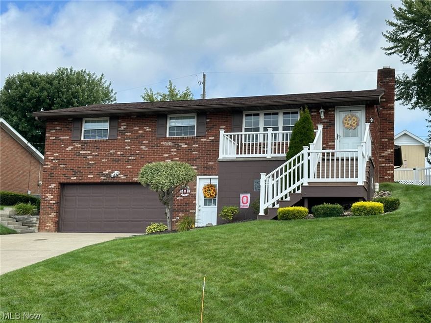 One look in the front door is all you need...Beautiful hardwood floors Throughout Living area. Kitchen and baths have been updated. New roof 2017, New gas furnace 2020, new AC 2021. Family room off of the kitchen with French doors to a Trek deck and patio area, front porch is also Trek decking with Vinyl around front porch and vinyl railings. The yard is great for entertaining with white vinyl privacy fencing. The Bonus room in basement can be a 4th bedroom and also has a full bath in the very clean and large laundry room. Talk about storage ...the basement has a finished crawl space with tons of storage and a large 2 car garage with plenty of room PLUS, there is a storage room under the porch for Lawn mowers and yard equipment AND an adorable shed in the backyard  with electric. 
Call quick to see this beautiful home centrally located in Steubenville.