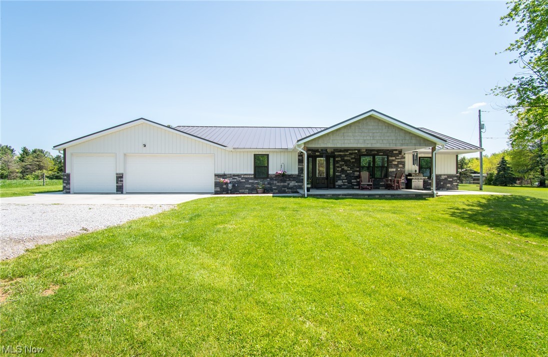 Welcome to this stunning, as good-as-new home in Wooster! Boasting over 2,000 sqft of living space and a sprawling 2.7-acre lot, this home features an open floor plan, perfectly styled finishes such as stainless-steel appliances, and beautiful flooring. As you enter the front door you are welcomed with a large living room with vaulted ceilings, beautiful eat-in-kitchen with custom made hickory cabinets and a sizable center island. Beyond the home itself, the property comes complete with all the space you need for your hobbies and passions. The 3-car attached garage is a hobbyist dream, offering ample room for parking and storage, as well as a dedicated home workshop. You'll also appreciate the convenience of a detached insulated 36x56 shop with two overhead doors - perfect for storing your boat, RV, and all the toys, gear, and equipment your heart desires! If you love spending time outdoors, the yard is ample, providing enough space for outdoor activities and year-round entertaining. I