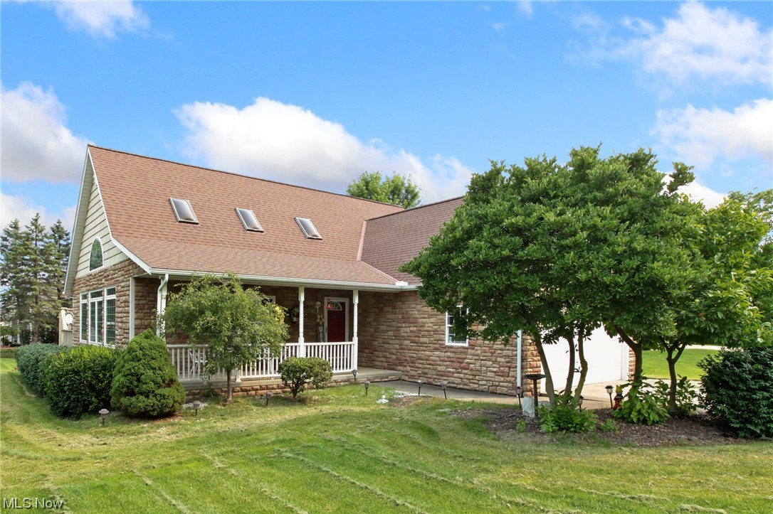 Welcome to this custom built, one-family-owned, Cape Cod style home featuring a first-floor master suite, located on over .58 of an acre property in the Charter Lakes Estates community with no Homeowners Assn fee in Nordonia Hills City School District, with inviting front porch, large deck with included hot tub, and an oversized shed. This open-concept home has a total of 4 bedrooms, 2.5 baths, hardwood floors throughout the first floor, dining area with access to the deck, and eat-in kitchen with breakfast bar and stainless steel appliances. The owners' suite features a walk-in closet and en-suite bath with jetted soaking tub and separate stand-up shower. A 2nd-floor loft overlooking the great room, full basement with lots of potential, and attached 2-car garage round out the tour. Since building, the owner has completed many updates making the home in the condition it is today, including: Replaced roof (2015), windows (2017), furnace & A/C (2022), hot water tank (2022), dishwasher &
