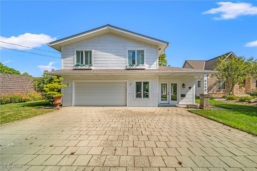 Lakefront living in the Mentor Harbor Lagoons with direct Lake Erie access. This 3-bedroom, 2.5-bath home includes five private docks located just behind the house—perfect for boaters. Walk to the Mentor Harbor Yacht Club or relax in the three-season room featuring a wall of glass that overlooks the water. The finished walk-out lower level opens to a covered stone patio, ideal for outdoor enjoyment and entertaining. Multi-level decking leads from the home down to the docks and private boat house. The owner's suite currently uses Bedroom 2 as an expanded dressing area and walk-in closet. Designed for buyers seeking a boating lifestyle and water views, this home offers the rare combination of privacy, dock access, and indoor-outdoor living.