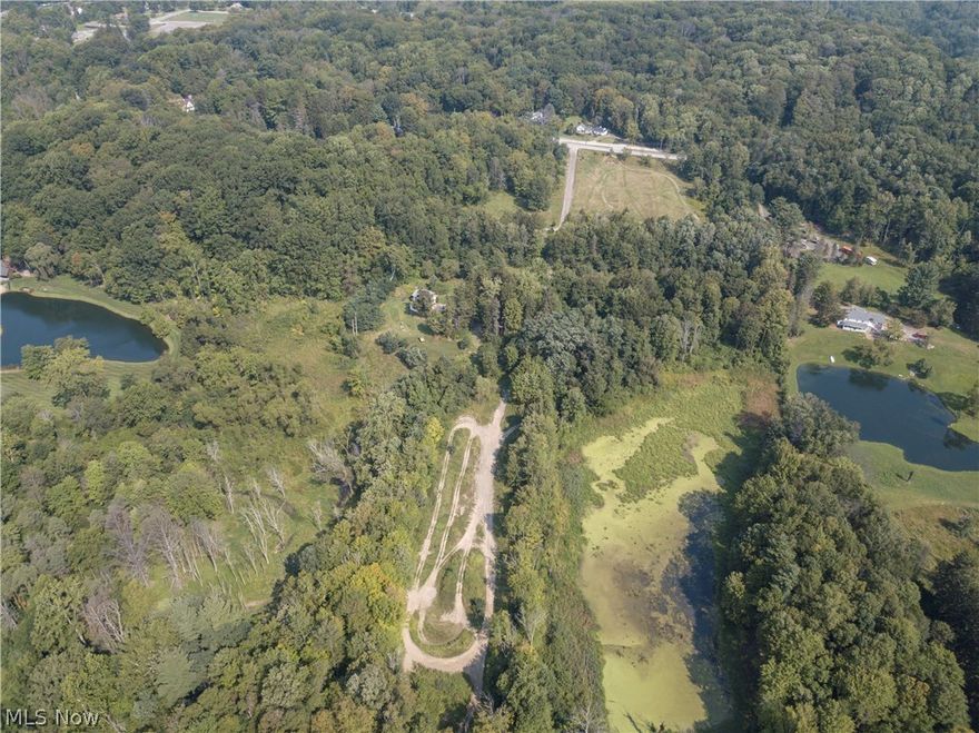 Natural surroundings abound these 38 acres!   Whether you enjoy hiking, fishing, bow hunting or the faster sports of quad running and motor biking, this is truly the best example of “Where the City Meets the Country!  This property would be the perfect location for an EQUESTRIAN CENTER. Wildlife including our beloved bald eagle, hawks, beaver dams, turkeys or turtles can be appreciated throughout the land. There are currently 2 houses on the property. MAIN HOUSE has 4 bedrooms, 1 bath, and 1,497 square feet.  The BUNGALOW has 2 bdrms, 1 bath with kitchen, dining room and living room with fireplace. There is a full attic that can be finished for additional living space. The Bungalow can be used as a rental or guest house while the other is utilized as the main living quarters. Both houses are in need of TLC so  you can choose to remodel or start from scratch and BUILD THE DREAM HOME you've always wanted. The main home is wired for a generator. The seller may be willing to include an add