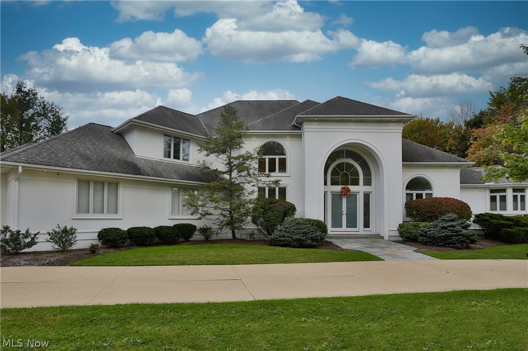 Elegant & dramatic custom built home with impeccable attention to detail & quality craftsmanship! Light and bright with floor to rooftop windows, the welcoming great room offers views of the private yard. The adjoining formal dining room is ideal for entertaining. Steps away, the kitchen has granite center island, an abundance of cabinetry a step-in pantry, and a delightful morning room/sunroom for casual gatherings. The master wing conveniently located on the first floor includes a library (currently used as a bedroom), spacious closets, pampering glamour bath and sliding door to the private deck. Upstairs, are four additional bedrooms with two full baths. The lower level is extensively finished with room for media, games and a kitchenette too! Very special with neutral decor throughout, this home is ready for new owners. 3 car garage has been professionally updated with epoxy flooring and cabinetry for a clutter free look!
