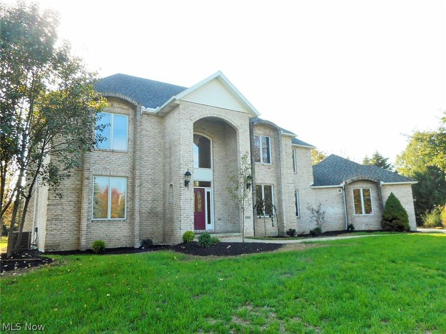 All brick 2 story- 3 bedroom 3.5 baths. Second floor master suite with fireplace, master bath with stainless steel shower and walk in closets w/ built ins. Loft could be converted to 4th bedroom. 2 story great room and foyer. French doors from living room, first floor laundry. Partially finished lower level. Large 3 car side load garage. 1.24 acres. Revere Schools.