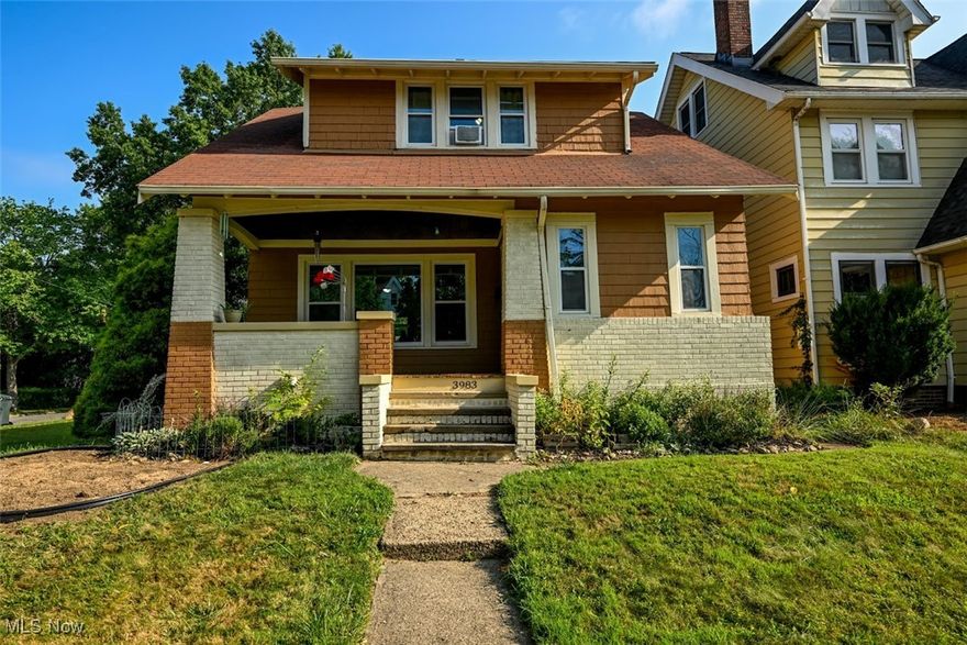 Welcome to 3983 Ardmore Rd. where 1920s charm meets modern updates! Sitting on a beautiful corner lot, this home offers ample outdoor space and a two car garage. Enjoy the view of a timeless Cleveland Heights neighborhood from the large front porch or spend time in the very private, fenced in backyard. The home is at a walking distance from the local elementary school and library. House has NEW ROOF! Step inside this colonial where gorgeous hardwood floors are in abundance! The entryway has a spacious closet sure to be useful in every season. The living room contains a cozy fireplace with shelves, lots of natural light, and is open to the dining room which contains a charming built in window seat with drawers for even more storage. The updated kitchen has a sizeable stainless steel refrigerator and granite countertops. A bonus area that can be utilized as a large pantry, breakfast nook, or mudroom among other things is also located on the first floor, as is a convenient half bath. On the second floor you will find all four bedrooms, each with hardwood floors, and one containing a cedar closet! A beautifully updated full bath completes this level. Schedule your showing today!