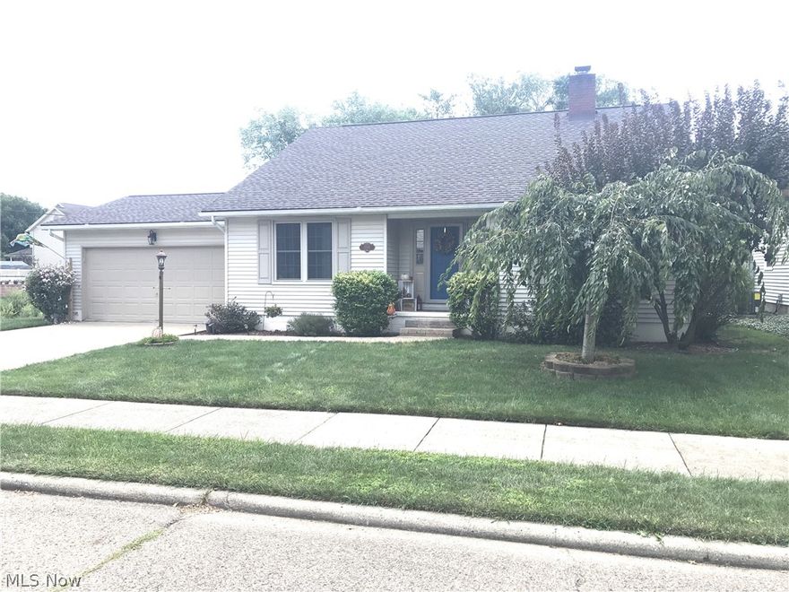 Charming 3 bedroom, 2 bath cape cod.  Oak hardwood floors in the foyer.  Vaulted ceilings in the living room with fireplace.  Oak kitchen with Corian counters features an island with quartz counters and french doors to the 12 X 16 deck.  First floor master suite with ceramic tile shower in the full bath, remodeled in 2017.  New carpet on the second floor which includes 2 bedrooms and a full bath, remodeled in 2017.  Water softener, new in 2017.  Gas hot water heater, new 2018.  Vinyl replacement windows throughout in 2012.  New roof in 2014.  Full basement with waterproofing system.  2 car attached garage.  10 X 8 storage shed.  Cabinet beside the fireplace in the living room is negotiable.  Right side fence is neighbors.