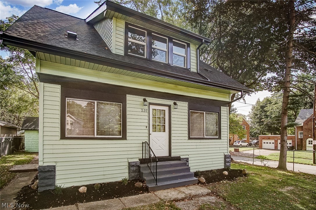 MOVE IN READY! Clean, freshly painted, gorgeous hardwood floors and well preserved natural woodwork throughout. NEW KITCHEN with white cabinetry, deep, stainless steel sink with gooseneck faucet, granite counter tops LVT flooring. Enclosed front porch with vinyl windows. Updates: newer roof, exterior doors, gutters, downspouts, furnace, central air, water heater and some new plumbing. Detached one car garage with freshly painted wood siding, new gutters/downspouts, and side door leading to the back door of the house. The driveway and garage are entered from the side street, Preston. The large yard features chain link fencing. The bedrooms are good sized and feature large closets. Most all windows have been replaced with vinyl and house exterior is vinyl sided.