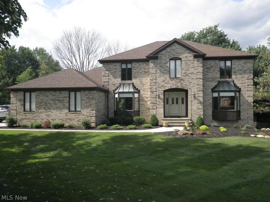 This impeccably maintained home sits on a picturesque 1/2 acre wooded lot. The treed backyard abuts Metro Parkway Drive. Spacious traditional floor plan with beautiful hardwood floors throughout first and second floors. Large foyer welcomes you to den, living room and then to wonderful fully equipped kitchen with many cabinets, walk in pantry; generous breakfast area. Striking updated family room features sleek fireplace, white beamed ceiling, granite wet bar,
glass doors to large deck. First floor laundry room. The Master suite with coffered ceiling walks out to a balcony/deck. Master Bath has large soaking tub, walk-in closet & skylight. Updated main bathroom and powder room. Finished lower level offers large daylight windows; separate billiard room, 18x14 ft, for great get-togethers. This is a very comfortable home with neutral decor. Wonderful neighborhood!