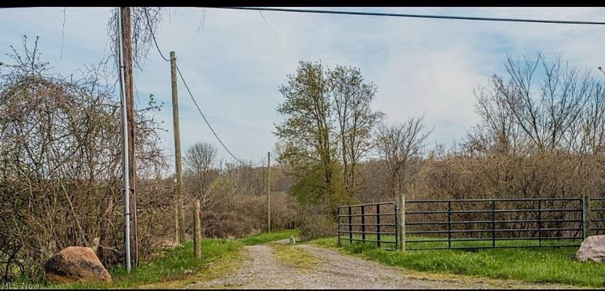 12.42 acres This land would be a wonderful place for anyone! Includes storage building on property which has access to electric. A large stream runs through the land.