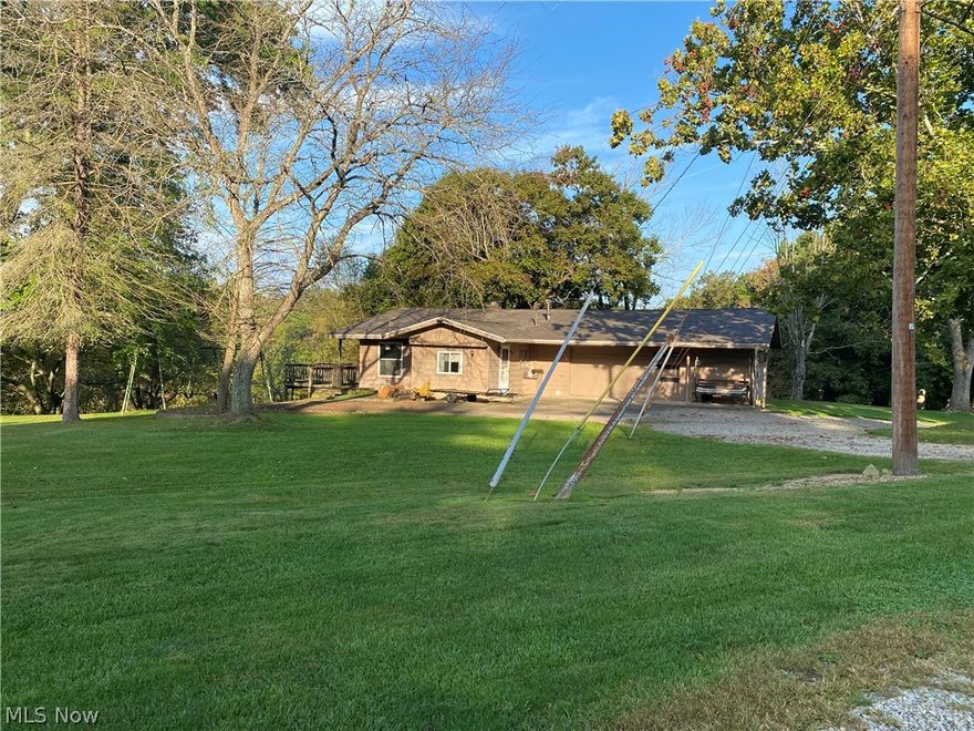 Lovely ranch home on 2 1/2  acres in Ridgewood Acres.  Home has breathtaking view of countryside, cathedral ceilings, fireplace & glass sliders leading to wood deck & awesome views.  Upgrades include bath, furnace, windows, roof, custom kitchen cupboards & stainless steel appliances including washer & dryer. There are 2 furnaces one heats the bedrooms and the new one in garage heats the rest of the home. Home is move in ready w/ no steps.  There is a possible 3rd bedroom in rear of home currently used as a mud room/furnace room.  The workshop behind garage could also be finished as additional living space. Long circular drive on dead-end street.