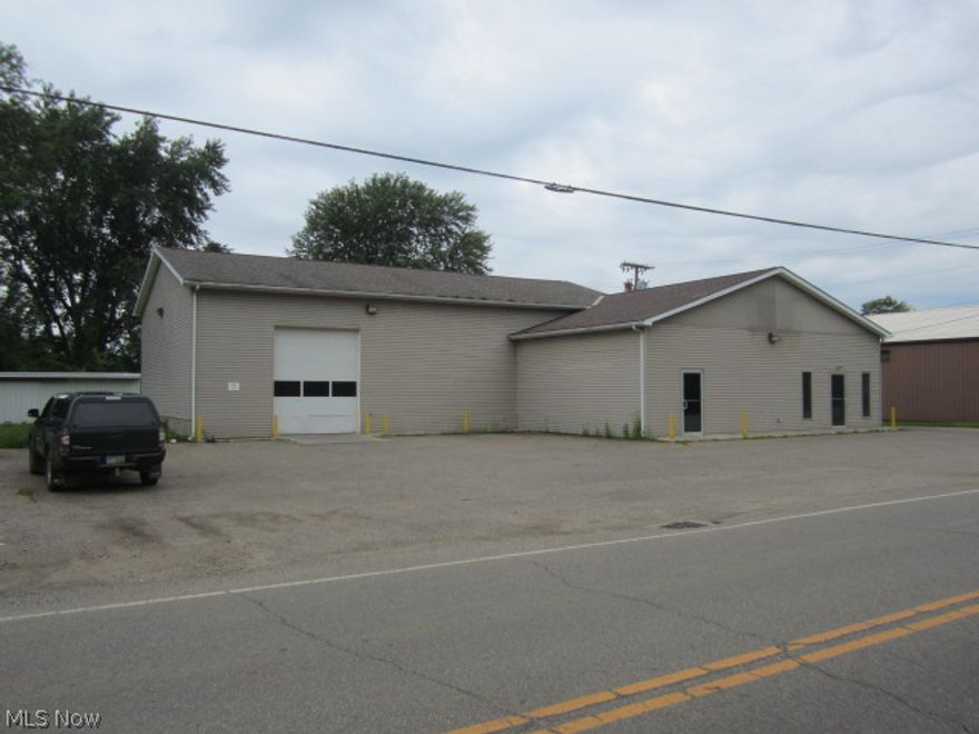 Three Buildings and lot on .48 acres, Otsego Ave. for sale. Built in 2004, this 4000 sq. ft. building is in excellent condition. 4 large bay doors, high ceiling, restroom, office, lots of storage, heated, inside finished with painted metal.  Truck doors, man doors,  outside pads, plus 2 pole bldgs, parking. This building can be used for multiple purposes.