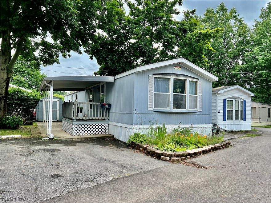 Fantastic opportunity to purchase an affordable home in Westwood Estates! This adorable 2 bedroom home boasts several updates including fresh paint, an updated bathroom with new tile shower surround, LVT and new carpet in the bedrooms. Nice-sized living room with vaulted ceiling. The bright kitchen with breakfast bar is spacious has a pantry and plenty of counter-space. All appliances including washer and dryer stay! The primary bedroom has double closets and is conveniently located next to the Laundry and bathroom. Outside there are 2 dedicated parking spaces and a patio area. The cozy covered deck could be converted back to a full carport. Shed included! This lovely community has mature trees, a playground and is located in Amherst Township with easy access to highways. No age restrictions, no pet restrictions other than a breed restriction. Call for your private tour today!