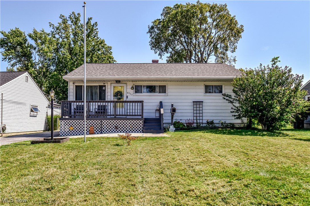 This home has 3 bedrooms, 1 full bath, and a galley kitchen with a gas stove, refrigerator, and dishwasher, which will stay, along with the washer and dryer in the unfinished basement. There is a 2-car garage with a concrete driveway, and a full chain-link fenced rear yard. There's also a front porch and a large covered back porch.
