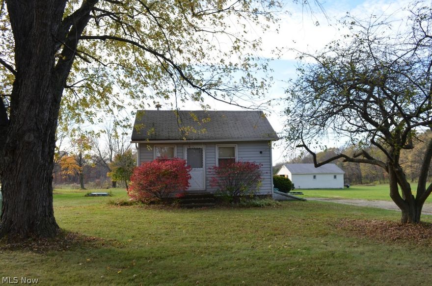 Hidden Treasure! Many options with this unique property! Looking for a house with 31.660 acres or a house with only 1.66 acres or 30 acres with no house? IT'S HERE! Live here, rent the house, grow crops or develop it! The possibilities are endless! Parceling will take place at the time of title transfer. Gorgeous property offers Rolling Hills, Creek, Trails for Walking, Riding a Horse or Dirt Bike! Beautiful views all around. A grass pasture up front is perfect for feeding horses, growing agricultural crops, building a new house or develop this site! Property can also be used for Hunting! Currently has small terrain park that can easily be graded. This cozy 2 bedroom home has a basement. Perfect for a rental property as well! BONUS! 30x20 Outbuilding is great for storing tractors, four wheelers, lawn equipment and outdoor toys! Give this some thought and then call for an appointment. Pricing for all scenarios available upon request.