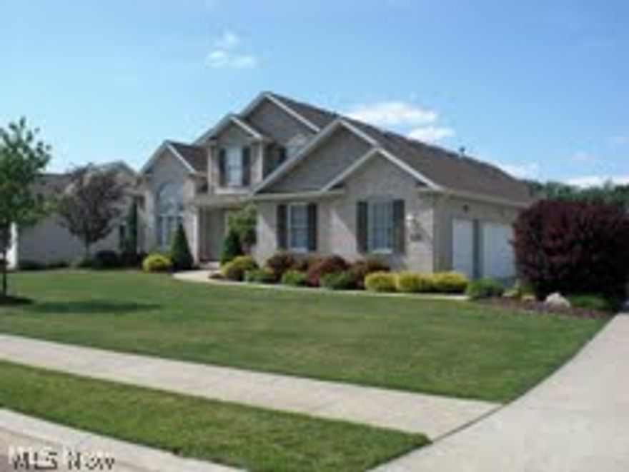 Fantastic dream home! This beautiful 2240 square foot home features three bedrooms with first floor Master, two story Great Room with windows surrounded by architectural detail, dramatic brick fireplace, Gourmet Kitchen with island, and Eating Area that walks out to the enclosed porch. Great lot, landscaping, a three car garage..and much more!