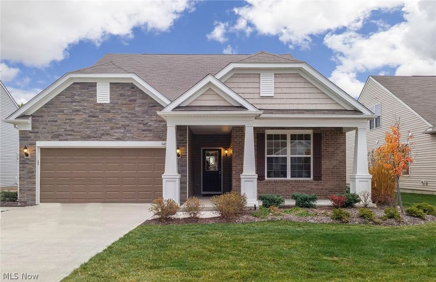 Del Webb MODEL home.  Perfectly situated home, backing up to the 8 acre amenity center.  Consumer-inspired ranch design with impressive layout for ease of living.  Brick and stone craftsman style front design welcomes you with a large porch.   Inside, hand scraped hardwood floors lead you from the foyer to the kitchen and gathering room, an open space perfect for entertaining as well as everyday living.  Includes a stone fireplace to the ceiling and large windows throughout for an abundance of natural light.  Kitchen is appointed with oversized granite island, upgraded maple cabinets with roll outs, and stainless steel appliances.  Screened in porch to enjoy outdoor living. Your Owner’s suite includes a private bathroom and large walk-in closet.  Also, features 3 three-car tandem garage with a 4’ extension for additional storage. Includes custom paint, decor hanging on the walls, window treatments, and rugs. In addition to your home, the resort style living at Pioneer Ridge is unlike a