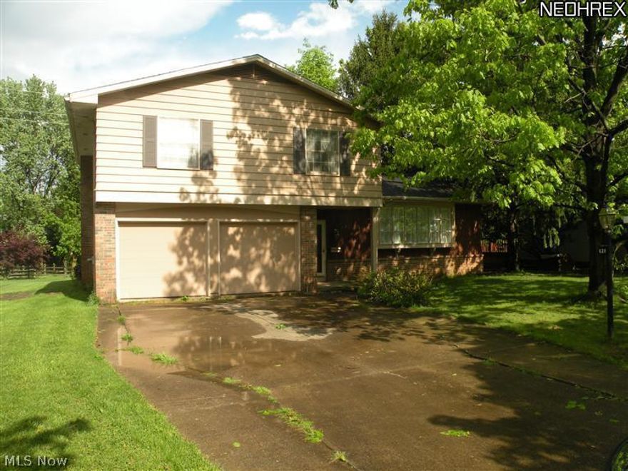 Don't miss this charming split level sitting on a gorgeous lot that is a little more than a quarter of an acre. Huge back yard has mature trees and plenty of room for entertaining under this over sized covered patio off the back of the home. Newer Roof and Furnace. Stunning hardwood floors throughout the main and upper levels. Four Bedroom on the upper level with 2 Full bathrooms on that floor as well. Living Room features gigantic window and vaulted cielings that are featured in the formal dining room as well. Family room has a cozy fireplace and sliding glass doors leading to the covered patio. Tons of storage throughout this beautiful home.