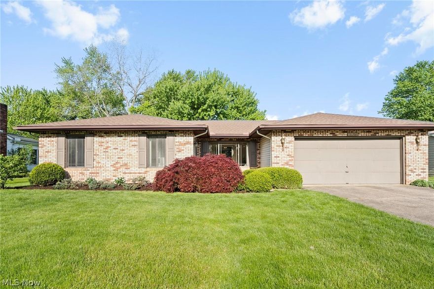Charming ranch home on a quiet street with no HOA. Enter in to the spacious living room featuring large picture window which leads into another sitting area, perfect for entertaining. Dining room and kitchen are warm and inviting; cream cabinets with peninsula and corian counters. Full bathroom off kitchen. Gorgeous engineered wood floors in living rooms, hallway, dining and kitchen. Light and bright sunroom overlooks the back yard. Spacious primary bedroom has a walk in closet. There are 2 additional nicely sized bedrooms flanked by another full bathroom. Basement provides plenty of storage space and laundry room, could be finished for additional living space. Two car garage. Paver patio and shed in back yard.  Roof 2022, furnace 2014. Close to shopping, restaurants and highways. Home was loved by long term owners and is ready for a new owner, schedule your showing today!