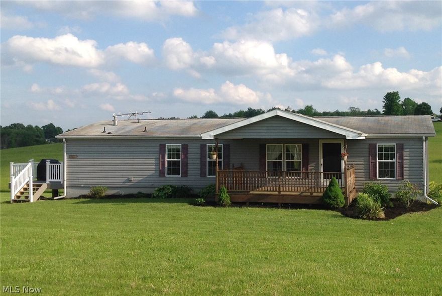 Beautiful spacious home sitting on 5 acres with full basement that is all ready to move in to!  This home has it all!  A large airy kitchen that's great for entertaining.  Sit on your new  composite deck that is less than a year old and enjoy the view, or your front porch on those warm summer nights.  Plenty of space and a master bath that features a  garden tub and a heated floor to keep you cozy on those  cold winter nights. Also included is a new  12 x 20 Shed. If you are looking for a a house with a view this is it!  Call today for your private showing.  Septic and well has been inspected and passed.