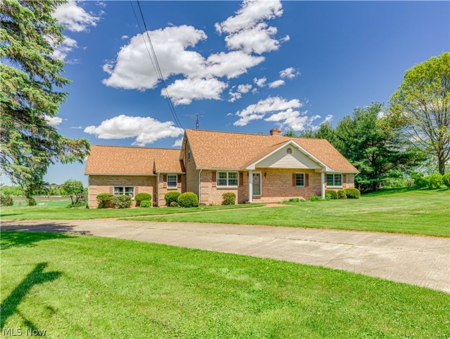 10320 Wanda Circle could be the one you have been waiting for! Quiet country setting, Lake Schools, spacious brick Cape Cod, oversized 3 car garage, first floor master, first floor laundry and best of all, it includes two extra parcels, each .46 acres with Middlebranch addresses.  Being sold as is. Updates include newer dimensional roof, some new windows, two newer Pella sliders leading to huge everlasting deck. Originally built in 1985 by reputable builder as his own home.   Outstanding woodwork, 6 panel doors, several pocket doors, kitchen cabinetry. Kitchen/Dining are opens into the fireplaced family room or the laundry room. Washer and dryer stay.  Living room, full bath, master bedroom with half bath and walk in closet complete the first floor. Upstairs you will find a full bath, 2 bedrooms with cathedral ceilings, lots more closet space, one more walk-in and more beautiful woodwork. 12-course basement could be finished