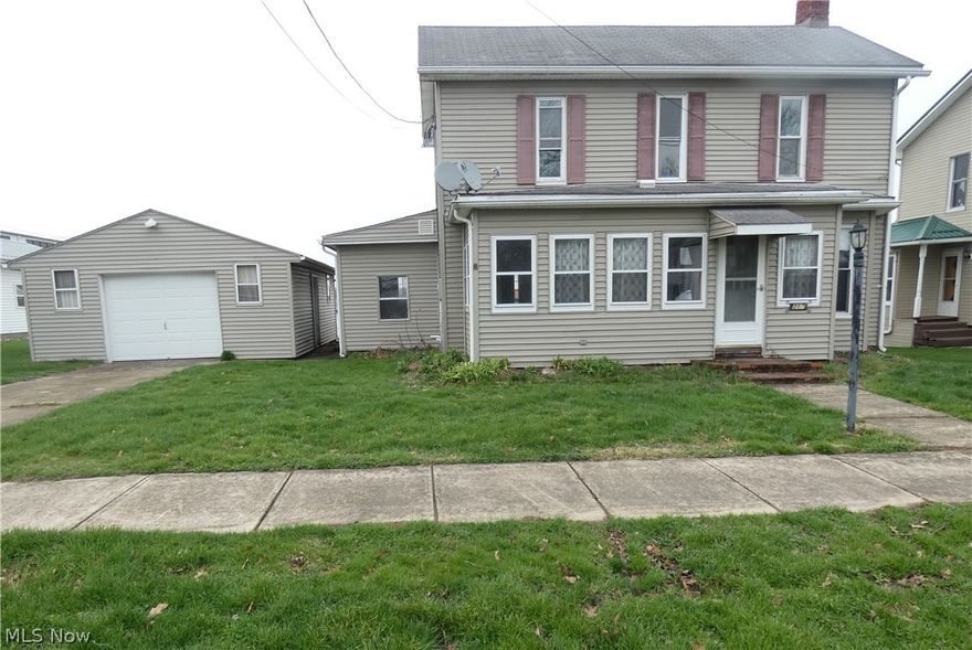 This attractive two story offers 3 bedrooms, 2.5 baths, an updated kitchen, a large back deck, an inviting enclosed front porch, vinyl siding, a large level lot, an oversized one car garage and LOTS of potential. Located just minutes from Piedmont Lake.