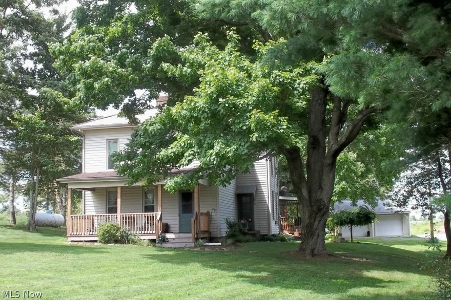 REDUCED TO $110,000!!!   BEAUTIFUL COUNTRY HOME that has been very well maintained!  Located on almost an ACRE in CRESTVIEW Schools.  Completely REMODELED KITCHEN in 2011 with hickory cabinets, laminate flooring, dinette area and custom counter tops; FAMILY ROOM renovation in 2010 with oak trim and 6 panel oak doors with separate heating and cooling system that could be utilized as a First Floor Master Suite; Formal Dining Room with built ins and hardwood floors; Living Room with beautiful staircase; Second Bedroom on First Floor and Two Additional Bedrooms upstairs; Remodeled Full Bathroom in 2010 with handicap accessible shower; First Floor Laundry; Second Full Bathroom oversized with double vanities, separate shower and claw foot bathtub; Rebuilt Front Porch with composite decking; Covered Back Porch; Newer windows in home from 2010 to 2011; Newer Two Car Garage and Hot Water Tank in 2009.  Call today to schedule a showing of this WONDERFUL Home!