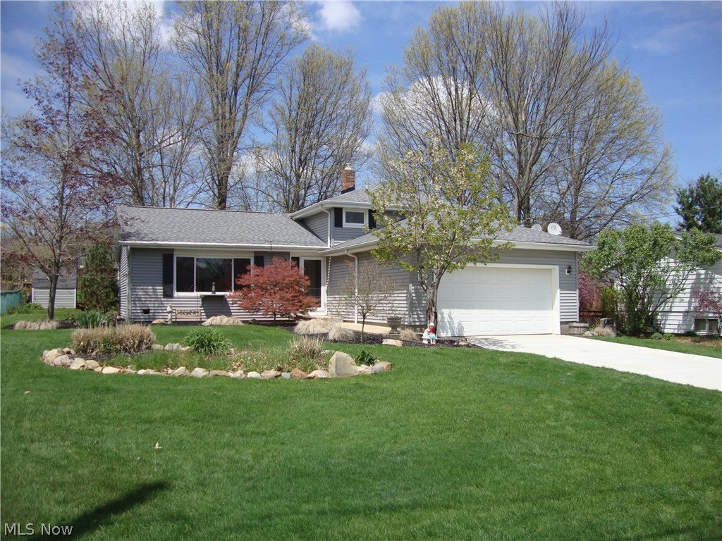 Get Here First! This spacious split level is conveniently located near shopping, schools, and highways in beautiful Twinsburg. Located on a quiet street this 3 bedroom and 2 full bath home with 1,744 square feet gives you plenty of room to spread out. The hardwood floors throughout are a timeless feature that are just waiting for your decorative touch. Two rooms have been combined to create an enormous master retreat. End your day by relaxing on your walkout patio or deck and looking out over your beautifully maintained yard. The driveway was replaced in 2015, Roof 2014. American Preferred Home Warranty offered with this home. Word gets around. Better call fast!