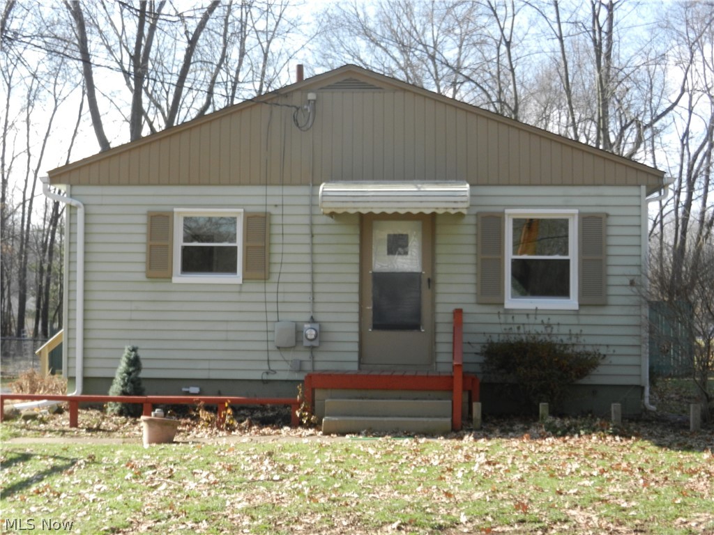 Freshly remodeled interior. New carpet and interior paint. All new interior wood trim, doors and hardware. Totally remodeled bath, sharp vanity with marble countertop. All new windows through out. Move in condition. Classic looking kitchen with new cabinet doors and new tile backsplash. Large full basement with some finish. The 20x24 detached garage has an attached rear 14x24 storage addition. Nice sized fenced in rear yard.