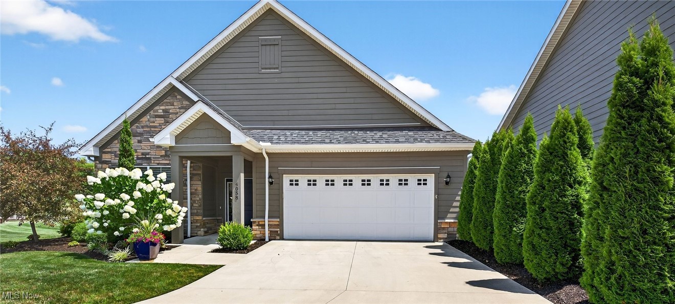 Move right in to this Ashley Model Ranch Home. This 1,928 square foot, Former Builder's Model Home has a custom expanded covered patio! The design offers an open floor plan, spacious island kitchen great for entertaining, lots of light and 10' tray ceiling entry with beautiful arched doorways. Features 2 bedrooms, 2 baths, Den, Large walk-in pantry in the kitchen, cozy covered porch which can easily be screened, 2+ car garage with extra storage and built-ins. Original Upgrades include granite, wood laminate floors, Stainless high-end appliances with microwave drawer, 42" staggered height cabinets, tile shower, designer paint colors, crown molding & stacked stone fireplace. Outdoors there is a Privacy Fence, and added Lush Landscaping with unmatched green space for extra outdoor use and activities. Enjoy a maintenance-free lifestyle with exterior repairs, lawn care and snow removal taken care of plus fun social events. The Courtyards at Plum Brook is located inside the Sanctuary at Plum Brook-Phase II. Minutes to freeways, shopping, medical facilities, dining, entertainment, golf, marinas and yacht clubs. Ride your golf cart across the street to Plum Brook Country Club and Osborn Metro Park with dog park, walking trails, and pickle ball. VA approved.