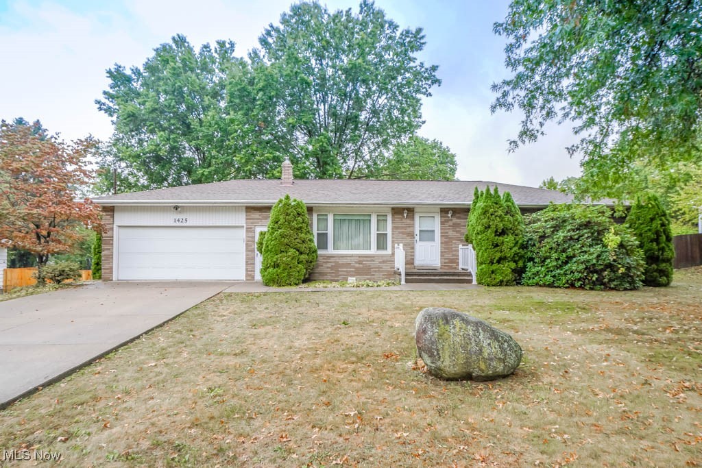 Come see this all brick ranch on half an acre in Green Local Schools! Inside, the layout includes a living room with a large picture window, a dining room with access to the deck, and a spacious eat in kitchen with plenty of cabinet storage. Down the hall are three bedrooms with hardwood floors, including the master with a private half bath, plus a full bath in the hall.
The basement provides extra living space with a bonus room that works well as a hobby or workout area, along with a rec room that walks out to the patio and fenced backyard. The location is ideal, tucked in an established neighborhood yet close to parks, Portage Lakes amenities, and major roads for an easy commute. Schedule your showing today!