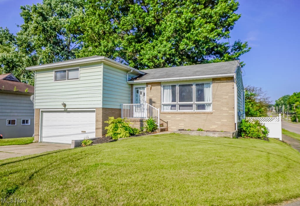 Tucked into a corner lot in a great North Canton location, this four level split has everything you need to feel right at home! Inside, the living room welcomes you with a large picture window, hardwood flooring, and a stylish accent wall. The refreshed kitchen features bright white cabinetry, stainless steel appliances, a tile backsplash, and concrete countertops with bar seating, plus a sunny dining area just steps away.
Upstairs, you’ll find three comfortable bedrooms with hardwood floors, built-in linen storage in the hallway, and a vintage full bath with tile walls and an extended vanity. The lower level offers a relaxed family room, a modern full bath with a step-in shower, and access to the two car garage. From here, you can also walk out to the patio and fully fenced backyard, great for kids and pets or just enjoying time outdoors. The basement includes laundry, mechanicals, and plenty of room to store belongings.
Located in the North Canton school district and close to everything you need, this is one you won’t want to miss. Schedule your tour today!