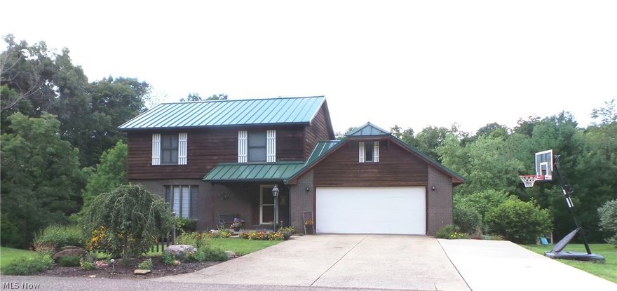 Beautifully Maintained 5 bedroom, 3 1/2 bath Cedar and Brick home, resting on a dead-end street boasts; Formal Living room, Formal Dining room with french doors that lead to a Huge back deck that overlooks the spacious backyard with shed. The Eat-in Kitchen offers tons of cabinet space, New Dishwasher, New Garbage Disposal, and Open floor plan includes the family room for the perfect entertaining area. The Finished walk-out basement offers an additional family room, bedroom, full bath, laundry room and storage room. The private drive/road has a verbal maintenance agreement with the neighbors which is split evenly. The Metal roof and Gutters is approx. 7 year old and the spouting hangers are new.  There is additional parking across the street for guests also, an additional concrete apron on the driveway for parking. This home is a MUST HAVE!!!