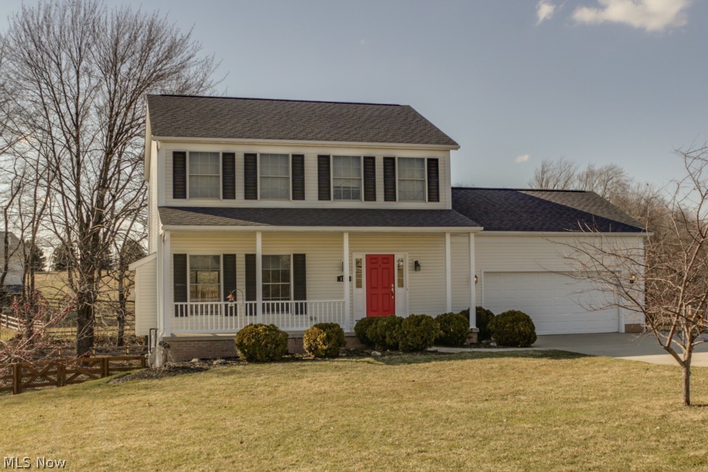 Wow! This 3 bedroom 2 1/2 bath Colonial has all the updates you could want in your new home. Why wait to build when this home is move-in ready? When you enter the front door you can immediately feel the difference of 9ft ceilings. There is gorgeous hardwood flooring in the family room, dining and kitchen. Ceramic tile is in laundry room and half bath. The Kitchen was totally remodeled and features Corian counter-tops w/ an eat ledge, Maple Shaker Cabinets w/soft close drawers, and lighting under the cabinets for the perfect entertaining ambiance. The gas fireplace is surrounded with stone and has a white mantle. The home is wired with a 5.1 home theater, HDTV pre-wired and wired with CAT6. Pella windows are throughout the home, HE 50 gallon water heater replaced in 2013, High Line GE Appliances replaced in the past 4 years, and there is a water softener and drinking system. The basement is a 13 course, walk out, and is rough plumbed for a future bathroom. The garage is oversized with 1